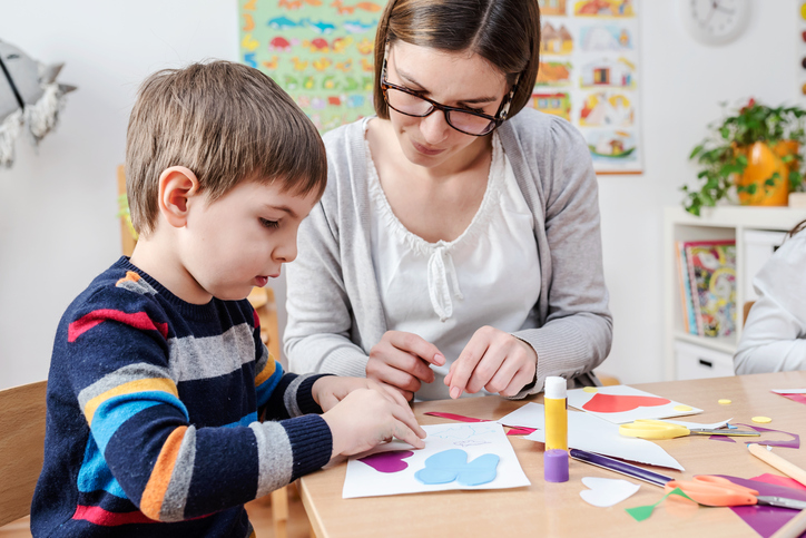 Mother with creative kid practicing