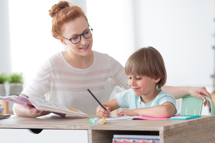 Little boy with teacher for lessons