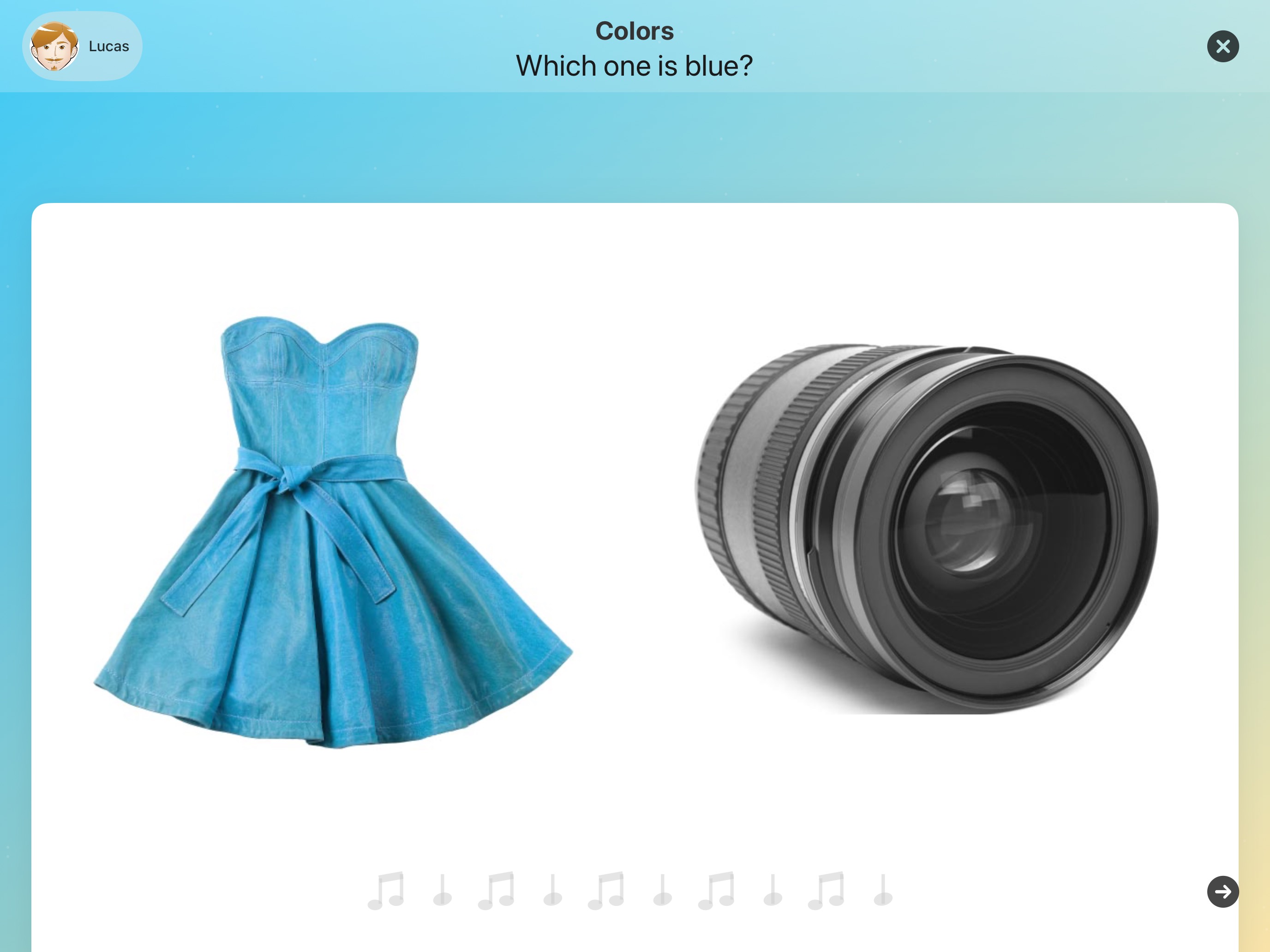 Adjective Remix asks: Which one is blue? A blue dress and a black camera lens