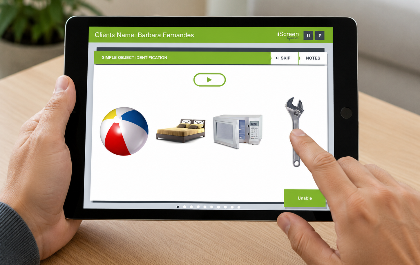 Clinician using iScreen Aphasia on an iPad